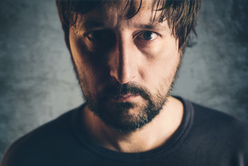 Dramatic low key portrait of adult male