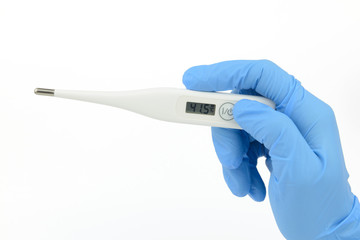 Obraz premium hand held digital thermometer, blue glove