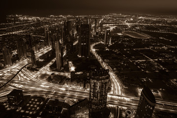 Dubai downtown night scene with city lights. Top view