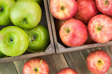 Assorted farm organic apples in crates.