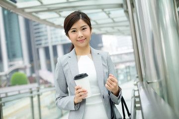 Businesswoman standing outside office