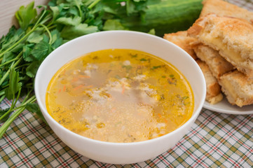 Soup with meatballs and toast with cheese