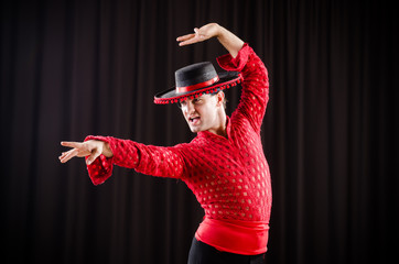 Man dancing spanish dance in red clothing