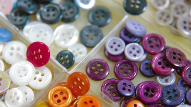 Tailor takinf button for sewing shirt