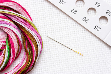 Embroidery. Preparations for cross stitch - canvas, needle, organizer and threads. 