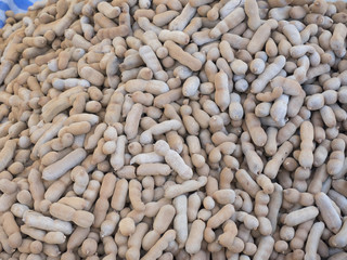 Group of ripe tamarind pods on the wood table.