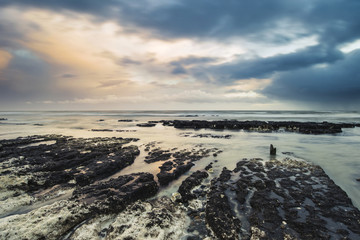 Stunningrocky beach sunset landscape long exposure