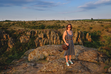 Fototapeta premium happy girl standing on a background of the canyon