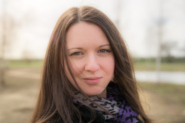 Obraz premium Beautiful girl with a purple scarf