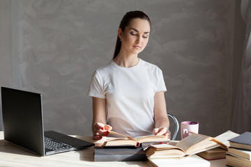 girl behind the books reads prepares for exams