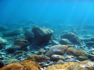 Underwater light on a rocky seafloor in the Mediterranean sea