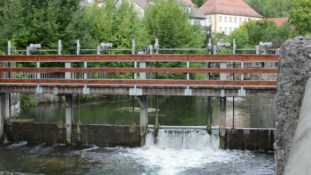 Weir on a river stream. Pottenstein, Bavaria