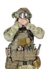 soldier or private military contractor closes eyes with her hands. war, army, weapon and people...