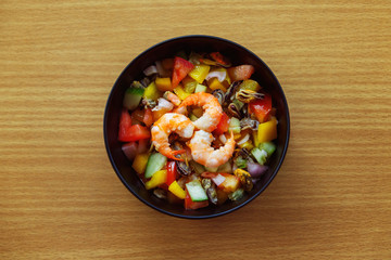Closeup image of healthy vegetarian salad with shrimps, calamari