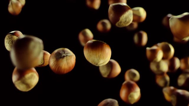 Nuts are flying on a black background