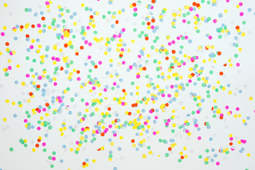 confetti on a white sheet of paper