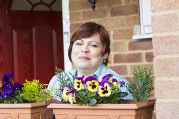 Happy woman relaxing at terrace and smiling