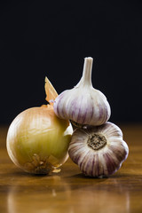 Onion Garlic and Ginger on Dark Background