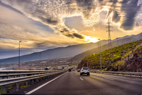 Auto highway with small traffic during sunset on Tenerife island, Spain