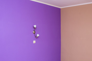 wall painted in bright color and wall lights