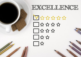 Excellence. White desk with a pencil and a cup of coffee.