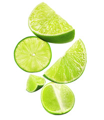 Fototapeta na wymiar Falling limes isolated on white