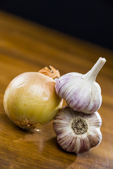 Onion Garlic and Ginger on Dark Background
