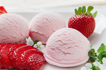 strawberry ice cream ball with fresh strawberries