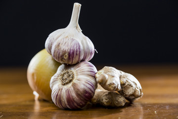 Onion Garlic and Ginger on Dark Background
