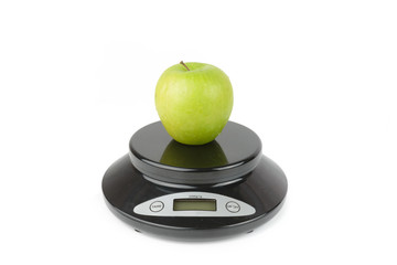 black digital scale, weight green apple