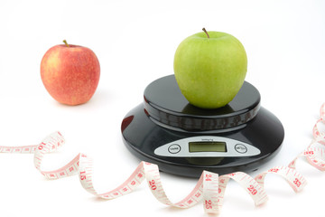 black digital scale, weight green apple