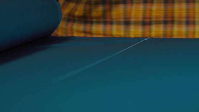 Tailors cutting supplies for sewing shirt