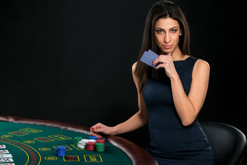 sexy woman with poker cards and chips