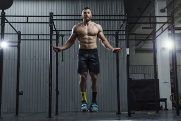 Bodybuilder doing jump rope