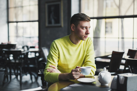 Lonely Man Relaxing In A Cafe