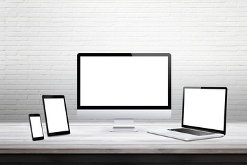 Devices with isolated white display for responsive web promotion. Computer, laptop, tablet, smart phone on desk