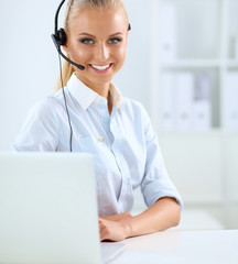 Close-up portrait of a customer service agent sitting at office