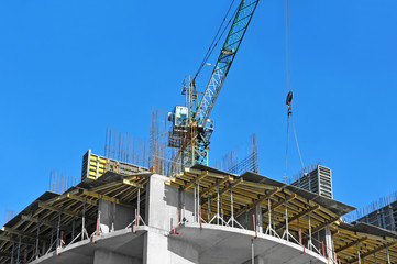 Crane and highrise construction site