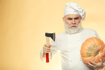 Cook with axe and pumpkin