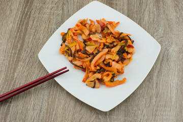Squid Salad / Calamari Salad (Chuka Ika Sansai). Asian salad of squid with vegetables on a white plate