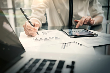 Analytical department working process.Closeup photo business woman showing reports modern tablet screen.Statistics graphics screen.Banker holding pen for signs documents, new startup. Horizontal