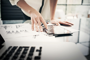 Finance department working process.Closeup photo business woman showing reports modern tablet...