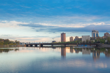 Naklejka premium Night city reflection on the river in Donetsk. Ukraine