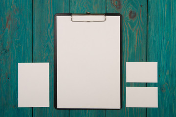 Blank sheet of paper and colorful office accessories