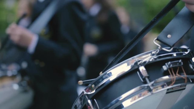 The musicians playing drums during Holy Week Processions.Close up of hands and drums.