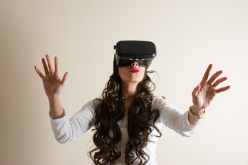Woman in virtual reality helmet. VR glasses.