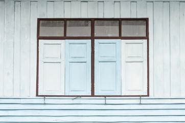Obraz na płótnie Canvas Thai style windows and old wood shutters