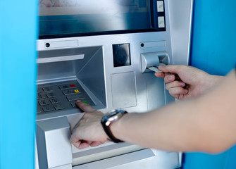 Man's using the ATM machine