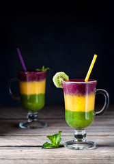 Smoothie with colorful layers from berries and fruits