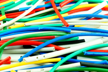 Network chaos of colorful cables. Close up.